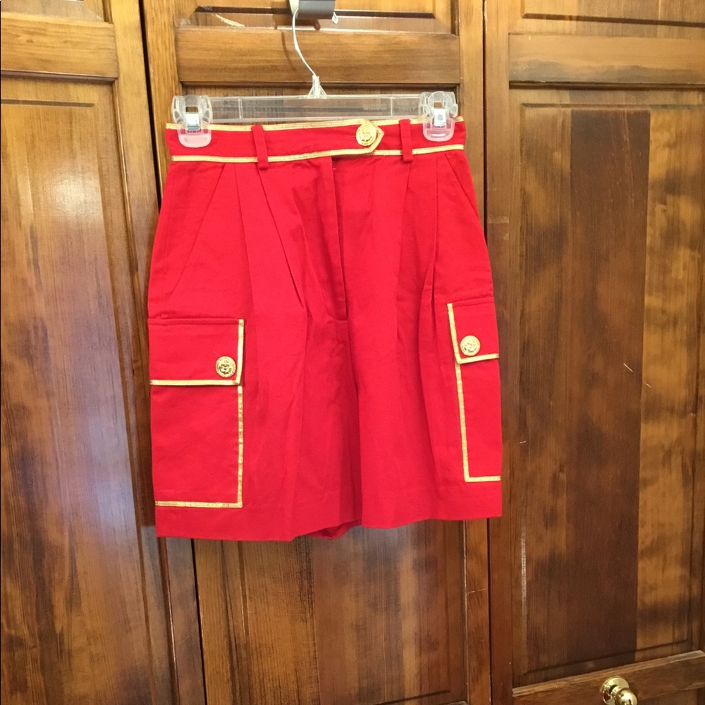 Dressy Icing woman’s shorts, gold piping highlights pockets and belt